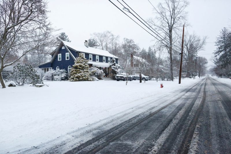 FILE PHOTO: A garden is covered by snow in Norwood, New Jersey, U.S., December 27, 2025. REUTERS/Kena Betancur/File Photo
