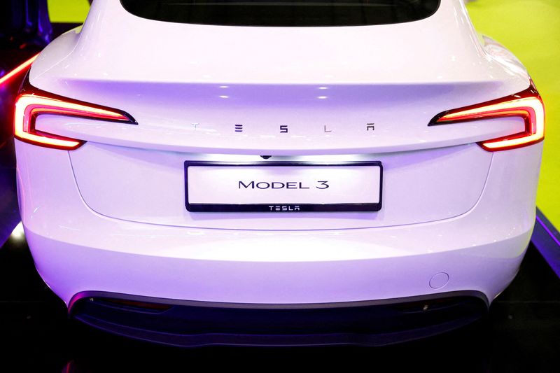 FILE PHOTO: Tesla Model 3 on display at the Everything Electric exhibition at the ExCeL London international exhibition and convention centre in London, Britain, March 28, 2024.  REUTERS/Peter Cziborra/File Photo