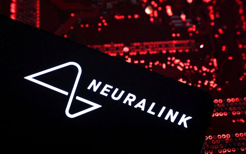FILE PHOTO: A smartphone with a Neuralink logo displayed is placed on a computer motherboard in this illustration taken on May 15, 2024. REUTERS/Dado Ruvic/Illustration/File Photo