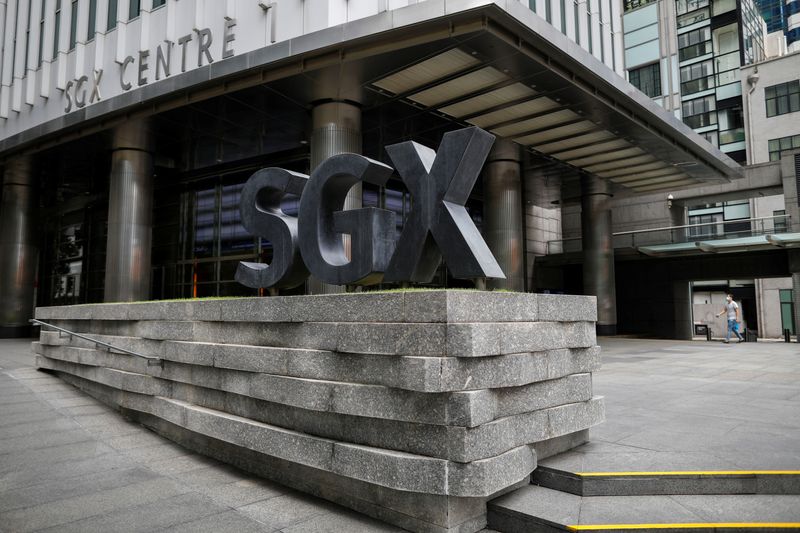 FILE PHOTO: Singapore Exchange's (SGX) logo is seen in the central business district, Singapore, April 7, 2020. REUTERS/Edgar Su/File Photo