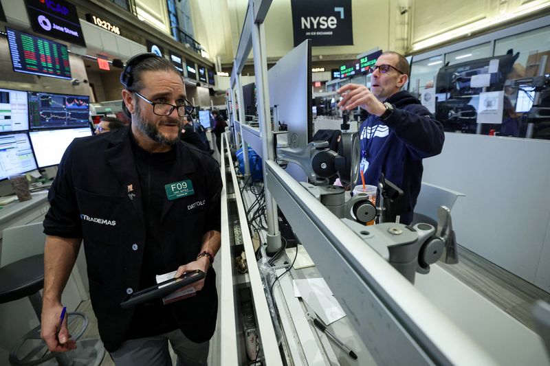Futures-options traders work on the floor at the New York Stock Exchange's NYSE American (AMEX) in New York City, U.S., January 15, 2026.  REUTERS/Brendan McDermid
