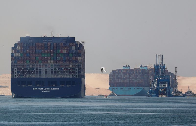 CMA CGM Louis Bleriot and a Maersk Line container ship pass through the Suez Canal in Ismailia, Egypt July 7, 2021. Picture taken July 7, 2021. REUTERS/Amr Abdallah Dalsh