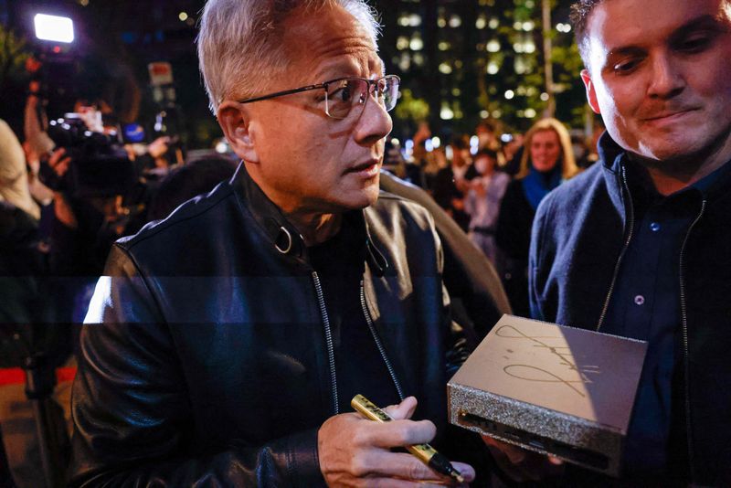 Nvidia CEO Jensen Huang interacts with supporters before a dinner he hosts with Taiwan tech CEOs in Taipei, Taiwan January 31, 2026. REUTERS/Ann Wang