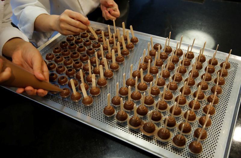 Empoyees of chocolate and cocoa product maker Barry Callebaut prepare chocolates after the company's annual news conference in Zurich, Switzerland November 7, 2018. REUTERS/Arnd Wiegmann