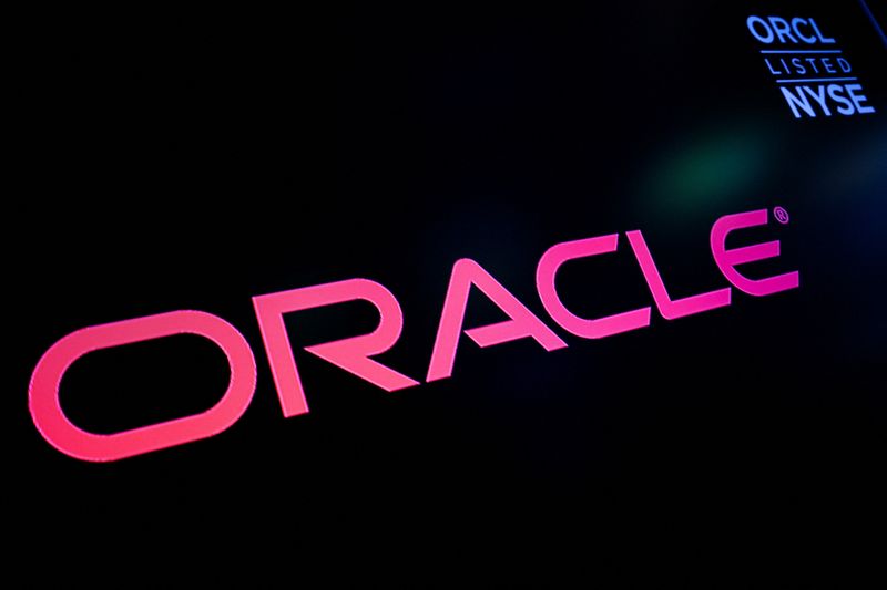 A screen displays the logo and trading information for Oracle Corporation on the floor of the New York Stock Exchange (NYSE) in New York City, U.S., March 30, 2023.  REUTERS/Brendan McDermid
