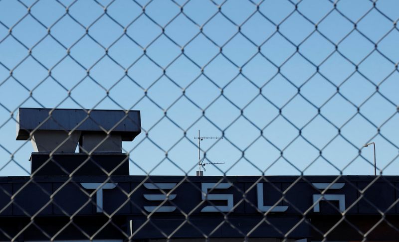 A Tesla sign is displayed over a Tesla showroom in Malmo, Sweden, December 14, 2023. REUTERS/ Tom Little
