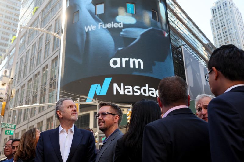 Arm executives and CEO Rene Haas gather outside Nasdaq Market site, as Softbank's Arm, chip design firm, holds an initial public offering (IPO), in New York, U.S., September 14, 2023. REUTERS/Brendan McDermid