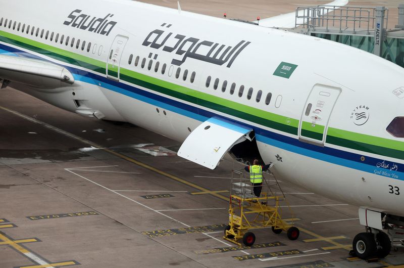 An aircraft belonging to Saudia, the national airline of Saudi Arabia, is seen on the tarmac of Manchester Airport in Manchester, Britain, October 15, 2024. REUTERS/Phil Noble