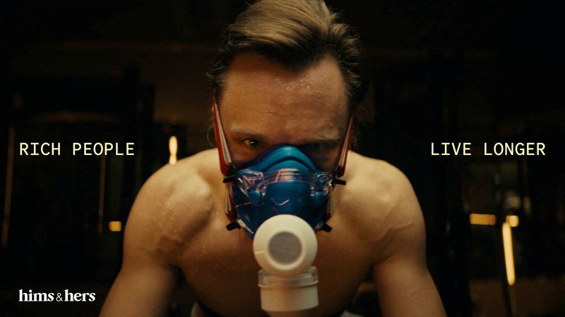 A man uses a mask while biking in this screenshot taken from an advertisement set to air during the Super Bowl, in Vancouver, Canada, December 11, 2025.  Hims and Hers Health Inc./Handout via REUTERS