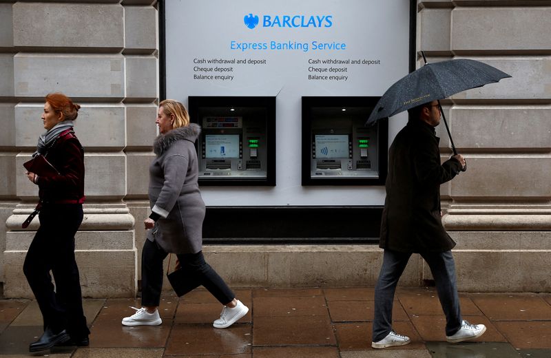 FILE PHOTO: People walk past a branch of Barclays Bank in London, Britain, March 17, 2023.  REUTERS/Peter Nicholls/File Photo