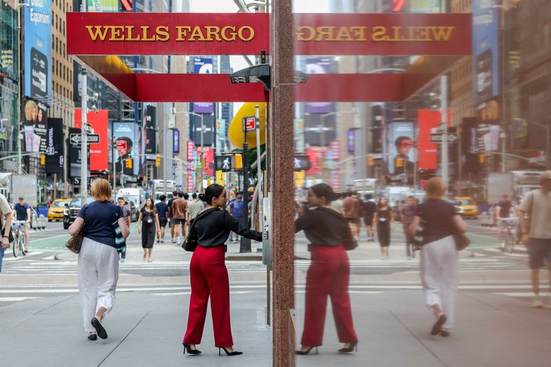 FILE PHOTO: A person enters a Wells Fargo branch in New York City, U.S., July 18, 2025. REUTERS/Kylie Cooper/File Photo
