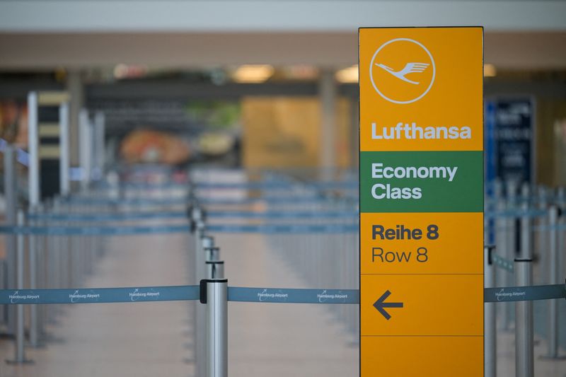 A sign with a logo of Lufthansa stands at Hamburg airport in Hamburg, Germany March 9, 2025. REUTERS/Fabian Bimmer/File Photo