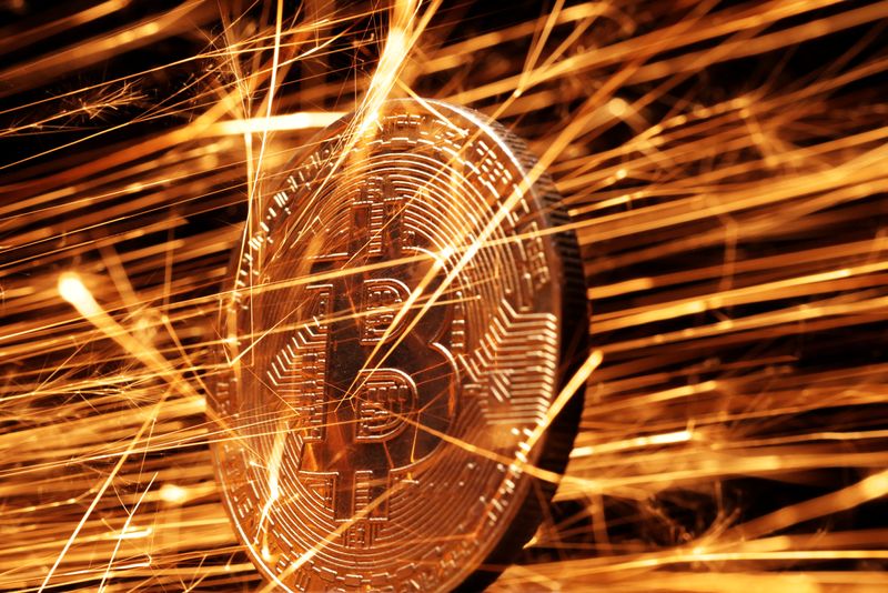 Sparks strike representation of cryptocurrency Bitcoin in this illustration taken November 24, 2024. REUTERS/Dado Ruvic/Illustration