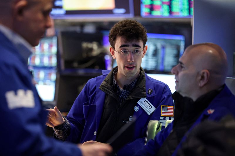Traders work on the floor at the New York Stock Exchange (NYSE) in New York City, U.S., January 26, 2026.  REUTERS/Brendan McDermid