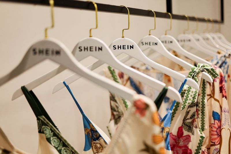 Clothes from fast-fashion brand Shein hang at their office in Sao Paulo, Brazil, December 15, 2025. REUTERS/Jorge Silva