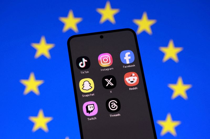 FILE PHOTO: An EU flag and smartphone with displayed social media app icons in this illustration taken February 3, 2026. REUTERS/Dado Ruvic/Illustration/File Photo