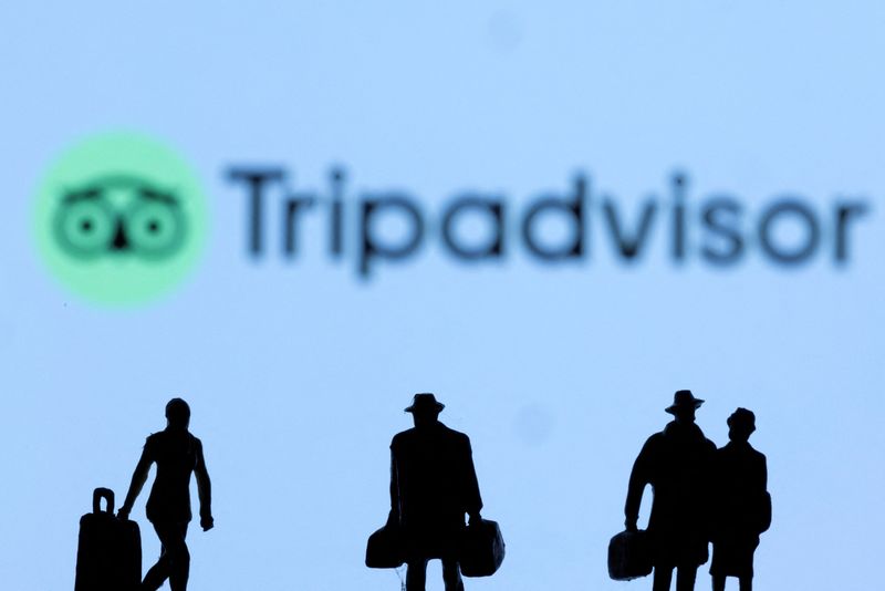 FILE PHOTO: Figurines are seen in front of the Tripadvisor logo in this illustration taken, February 27, 2022. REUTERS/Dado Ruvic/Illustration/File Photo