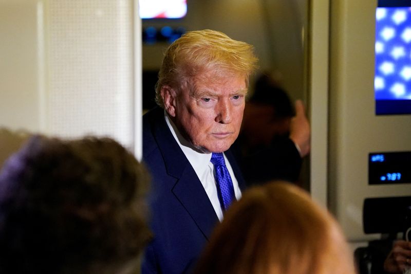 U.S. President Donald Trump speaks to reporters onboard Air Force One, on travel from West Palm Beach, Florida, to Joint Base Andrews, Maryland, U.S., February 16, 2026. REUTERS/Elizabeth Frantz