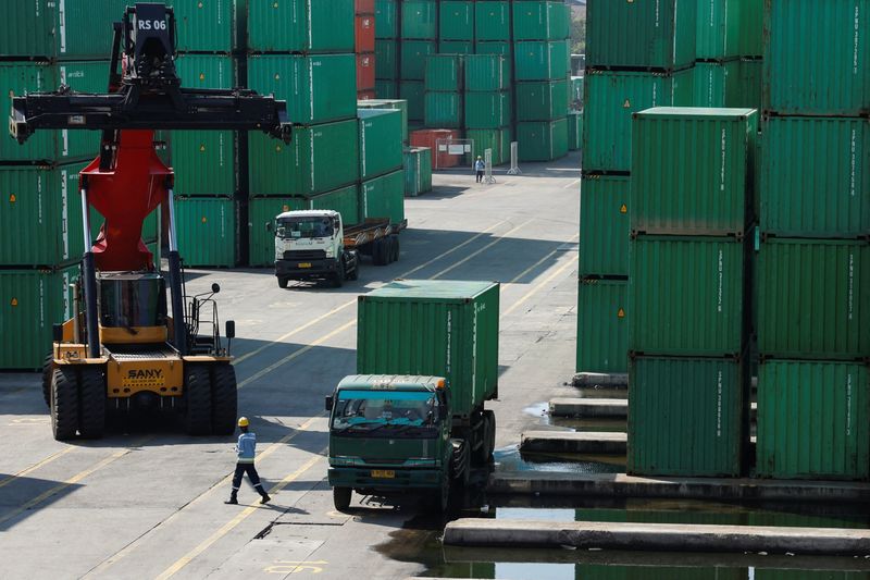 A container truck is unloaded from a truck at Tanjung Priok Port, in North Jakarta, Indonesia, July 8, 2025. REUTERS/Ajeng Dinar Ulfiana