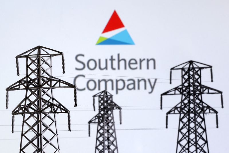 Electric power transmission pylon miniatures and Southern Company logo are seen in this illustration taken, December 9, 2022. REUTERS/Dado Ruvic/Illustration