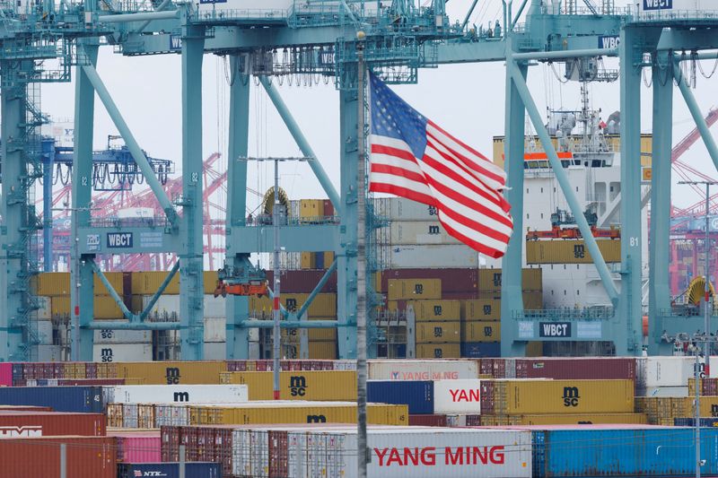 FILE PHOTO: Shipping containers from China sit at the Port of Los Angeles in San Pedro, California, U.S., November 5, 2025. REUTERS/Mike Blake/File Photo