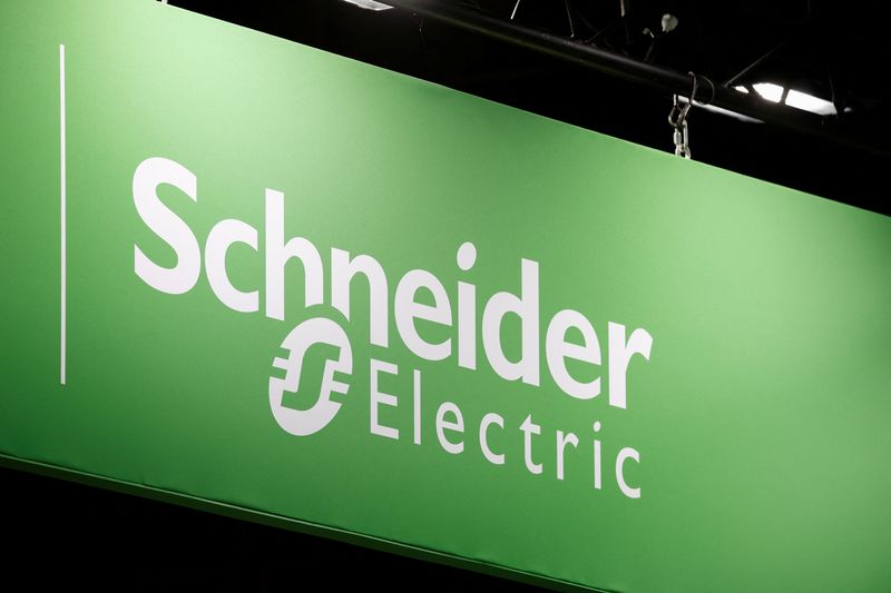 FILE PHOTO: The logo of Schneider Electric is pictured at the Global Industrie exhibition in Villepinte near Paris, France, March 26, 2024. REUTERS/Benoit Tessier/File Photo