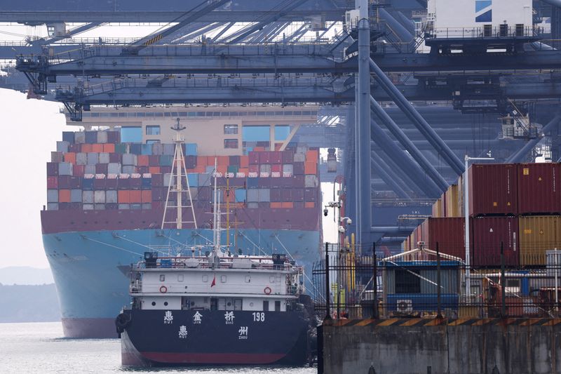 A cargo ship with containers docks at a terminal of the Yantian port in Shenzhen, Guangdong province, China October 30, 2025. REUTERS/Tingshu Wang/File Photo