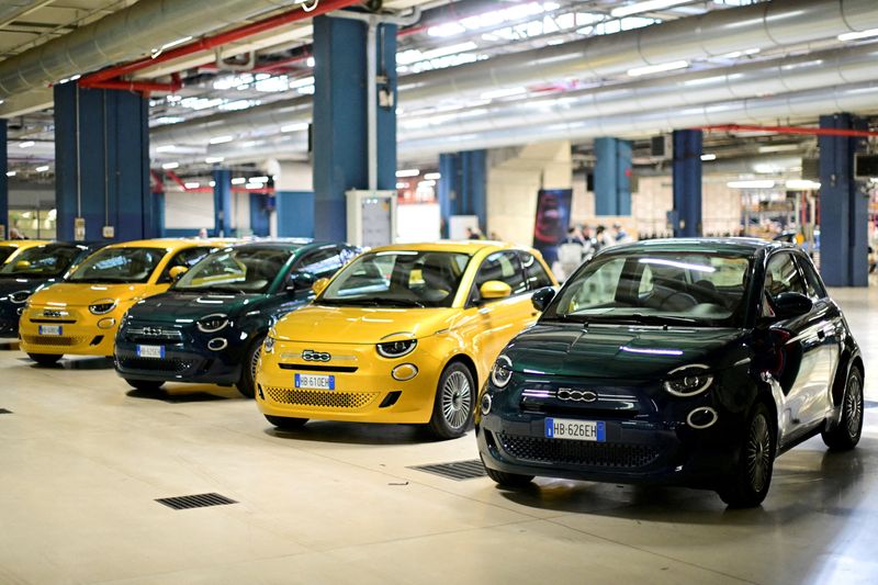 FILE PHOTO: Models of the new hybrid version of the Fiat 500 on display inside the Stellantis Mirafiori plant in Turin, Italy, November 25, 2025. REUTERS/Daniele Mascolo/File Photo