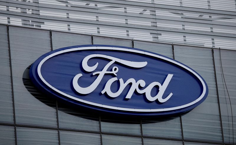 FILE PHOTO: The blue Ford oval logo is displayed on the new Ford World Headquarters in Dearborn, Michigan, U.S. November 16, 2025.     REUTERS/Rebecca Cook/File Photo