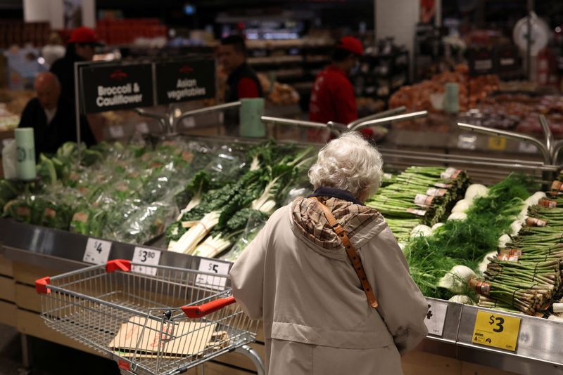 A shopper looks at vegetables displayed at a Coles supermarket in Bondi Junction, ahead of Coles Group announcing their first-quarter sales results, in Sydney, Australia, October 29, 2025. REUTERS/Hollie Adams