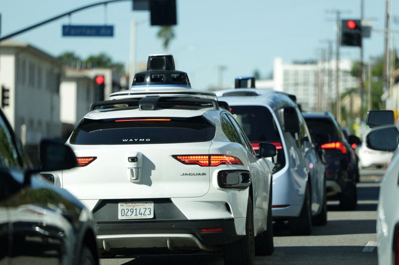 Waymo driverless taxis in traffic in Los Angeles, California, U.S., January 9, 2026. REUTERS/Mario Anzuoni