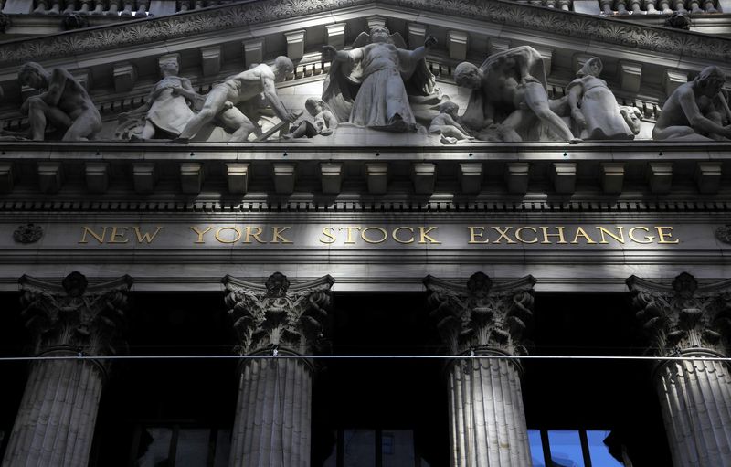 Morning sunlight falls on the facade of the New York Stock Exchange (NYSE) building after the start of Thursday's trading session in Manhattan in New York City, New York, U.S., January 28, 2021. REUTERS/Mike Segar