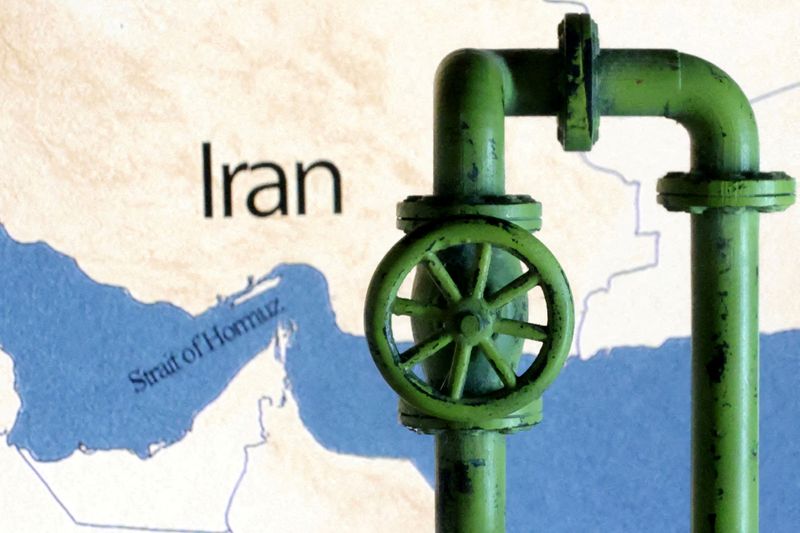FILE PHOTO: A map showing the Strait of Hormuz and Iran is seen behind a 3D printed oil pipeline in this illustration taken June 22, 2025. REUTERS/Dado Ruvic/Illustration/File Photo