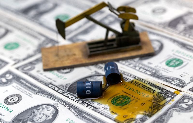 FILE PHOTO: Oil, miniatures of oil barrels, oil pump jack and U.S. dollar banknote are seen in this illustration taken, June 6, 2023. REUTERS/Dado Ruvic/Illustration/File Photo