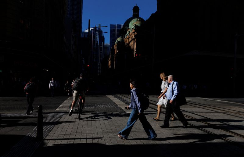 People cross the street in Sydney’s Central Business District, Australia, February 4, 2026. REUTERS/Nikki Short