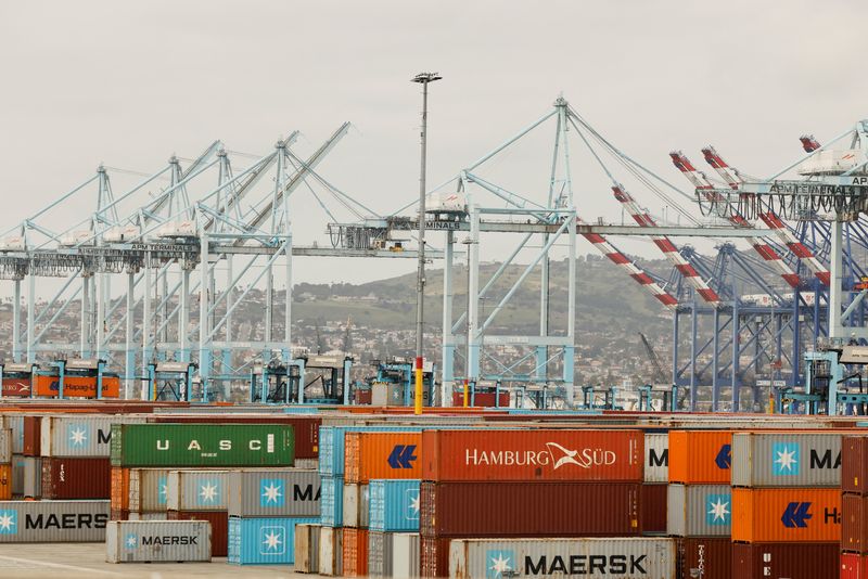Shipping containers are stacked at a terminal at the port of Los Angeles in Long Beach, California, U.S., March 10, 2026. REUTERS/Caroline Brehman