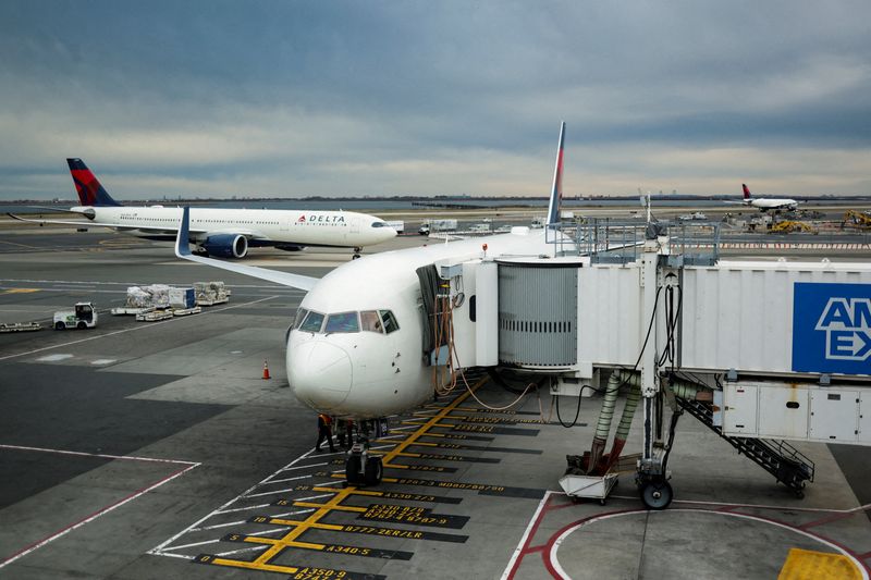 FILE PHOTO: Delta Air Lines planes at John F. Kennedy (JFK) International Airport in New York City, U.S., November 18, 2025. REUTERS/Jeenah Moon/File Photo