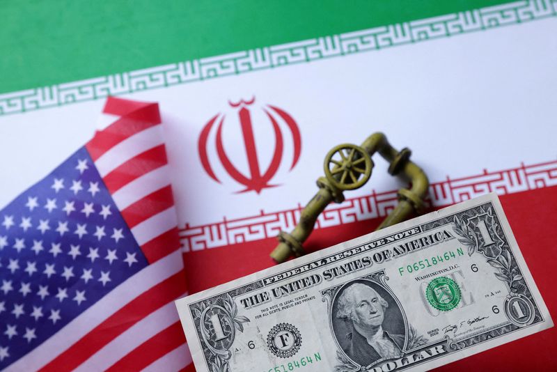 FILE PHOTO: A model of a natural gas pipeline, U.S. and Iran flags and a one dollar banknote are seen in this illustration taken June 18, 2025. REUTERS/Dado Ruvic/Illustration/File Photo
