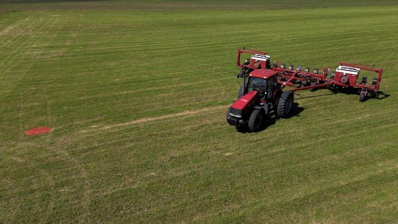 FILE PHOTO: A drone view shows a tractor and a soybean planter parked on a soy farm in Somonauk, Illinois, U.S., May 30, 2024. REUTERS/Jim Vondruska/File Photo