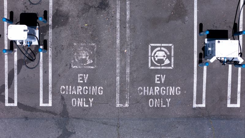 An electric vehicle charging location is shown from the view of a drone in Carlsbad, California, U.S., May 14, 2025. REUTERS/Mike Blake/File Photo