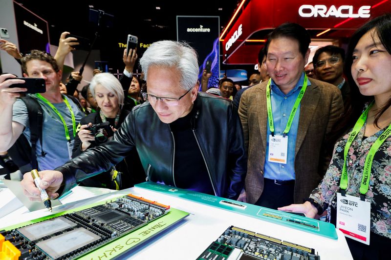 NVIDIA CEO Jensen Huang and SK Group Chairman Chey Tae-won attend the NVIDIA GTC global AI conference in San Jose, California, U.S. March 16, 2026.  REUTERS/Fred Greaves