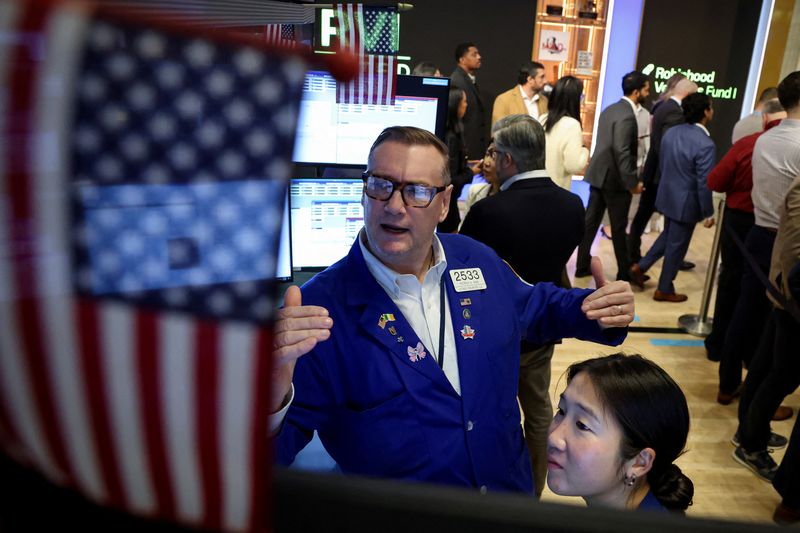Traders work on the floor at the New York Stock Exchange (NYSE) in New York City, U.S., March 6, 2026. REUTERS/Brendan McDermid