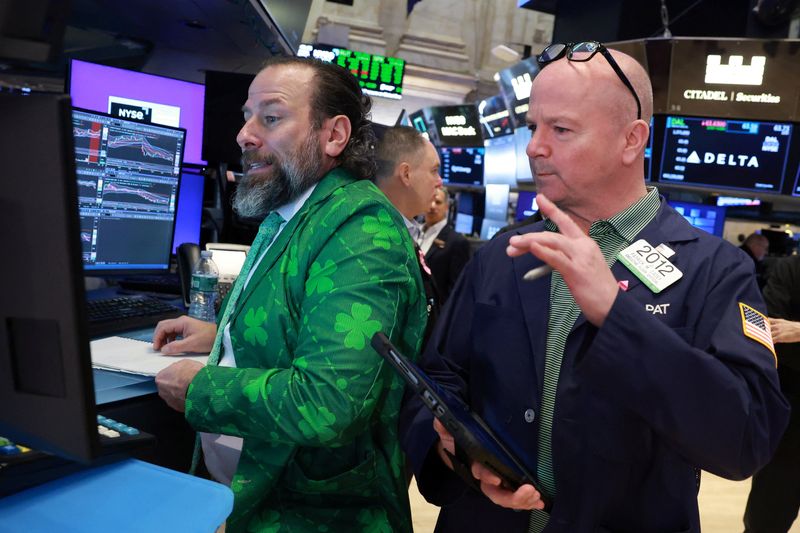 Traders work on the floor at the New York Stock Exchange (NYSE) in New York City, U.S., March 17, 2026.  REUTERS/Brendan McDermid