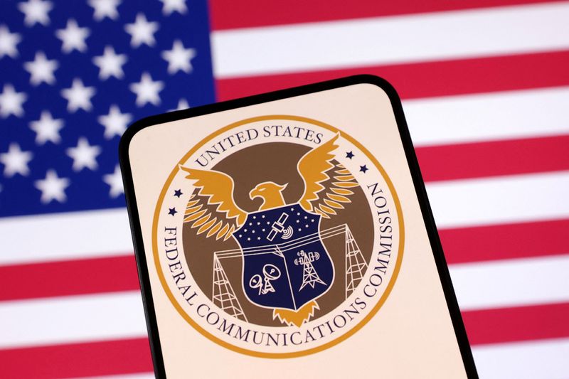 United States Federal Communications Commission logo and U.S. flag are seen in this illustration taken April 23, 2025. REUTERS/Dado Ruvic/Illustration