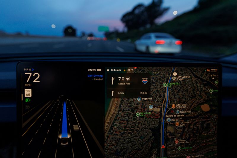A Tesla Model 3 is shown driving on the highway with FSD 14.2.2.3 self driving-supervised software in Dana Point, California, U.S., January 28, 2026. REUTERS/Mike Blake