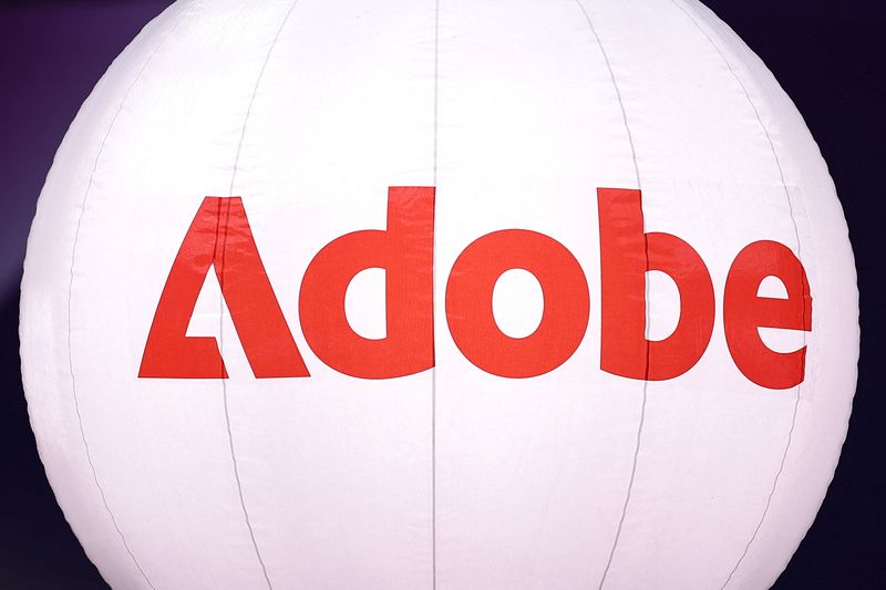 A logo of computer software company Adobe is seen during the Adopt AI International Summit at the Grand Palais in Paris, France, November 26, 2025. REUTERS/Abdul Saboor