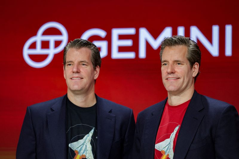 FILE PHOTO: Gemini Co-founders Tyler Winklevoss and Cameron Winklevoss attend the company's IPO at the Nasdaq MarketSite in New York City, U.S., September 12, 2025. REUTERS/Jeenah Moon/File Photo