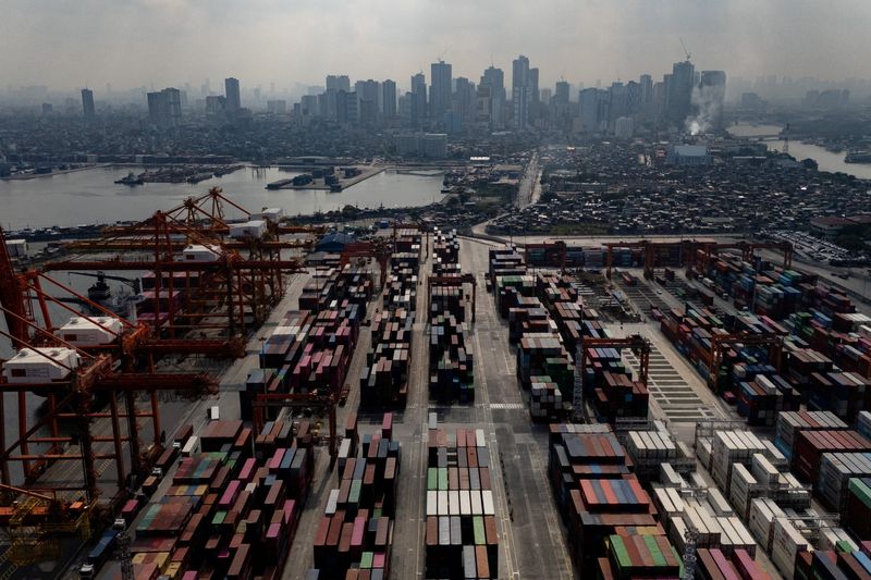 A drone view shows cranes and stacks of containers at the Manila International Container Terminal at the Port of Manila in Manila, Philippines, August 11, 2025. REUTERS/Eloisa Lopez