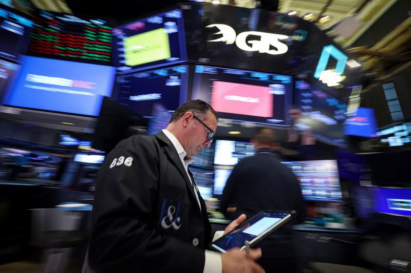 Traders work on the floor at the New York Stock Exchange (NYSE) in New York City, U.S., March 18, 2026.  REUTERS/Brendan McDermid