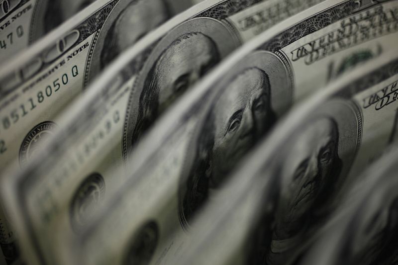 A picture illustration shows U.S. 100 dollar bank notes taken in Tokyo August 2, 2011.  REUTERS/Yuriko Nakao /File Photo